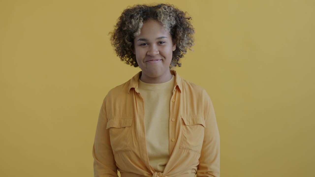 Woman Smiling in a Yellow Shirt