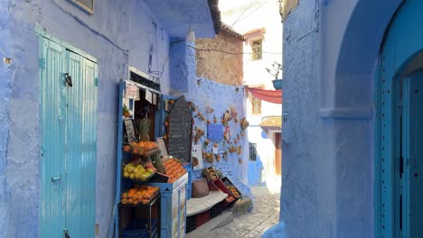 orange stall on a picturesque blue street in chefchaouen