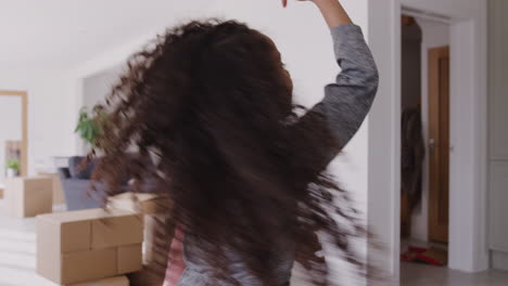 children dancing and having fun as they celebrate moving into new house