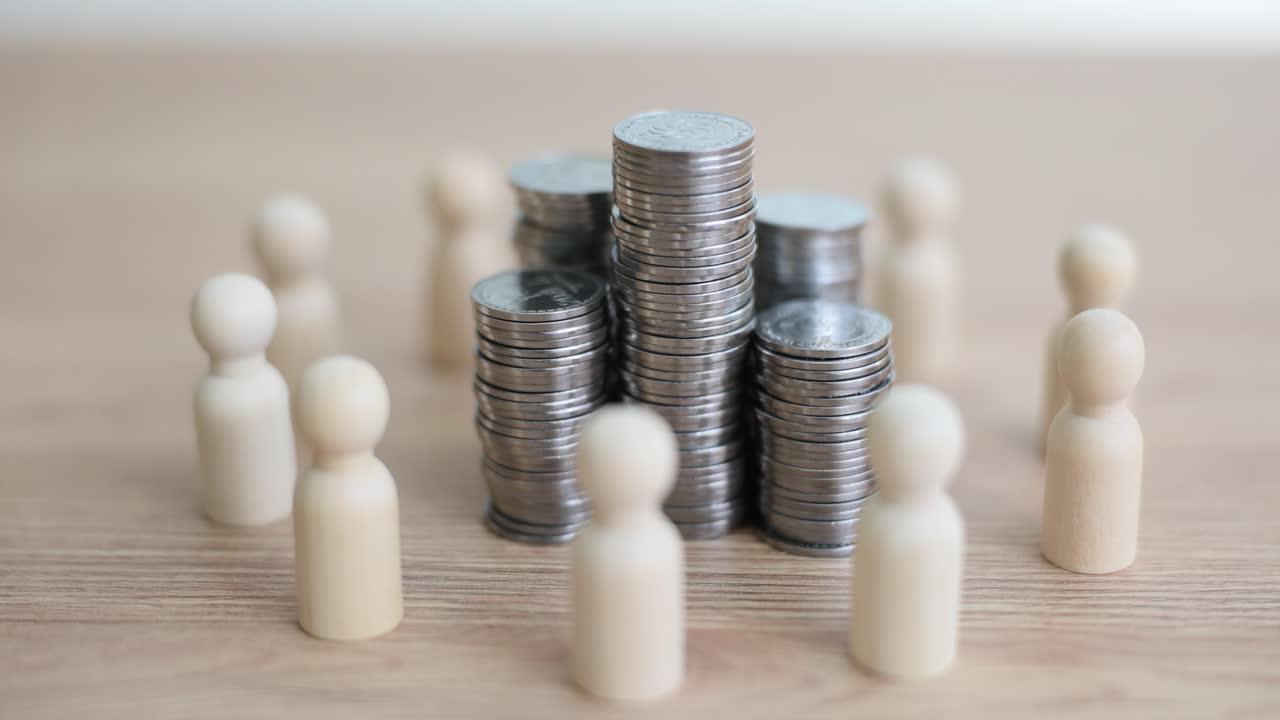 Wooden figures encircling stacks of coins, representing finance and collective investment
