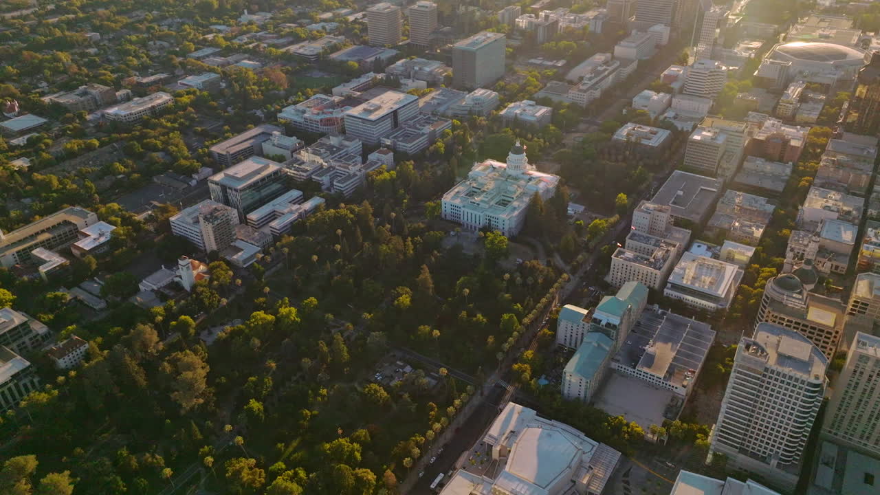 Beautiful city panorama with modern buildings and lots of greenery. Lovely urban scenery from aerial view.