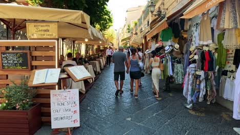 people walking along a vibrant market street