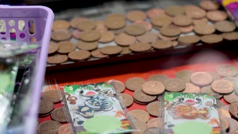 coins and cards in arcade game machine