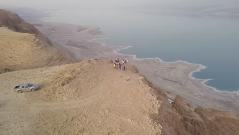 group of people enjoying the scenic view of the dead sea