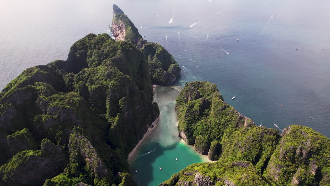 Aerial 4k top-down drone view of Phi Phi Leh, Pileh Lagoon, Krabi province, Thailand. Amazing tropical island with turquoise water and white beach, famous travel destination, clear turquoise water.