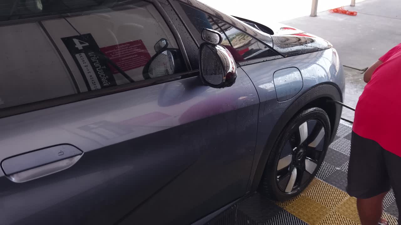 Electric Car Being Washed at a Car Wash