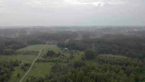 Drone-flight-over-a-country-road-at-dusk