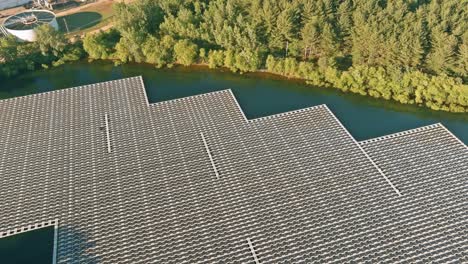 aerial view of floating solar panels on the water in pond