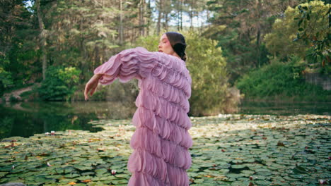 sensual girl fairy posing at beautiful forest lake covered water lilies close up