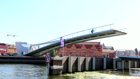 gdansk, poland old town, motlawa river and drawbridge lowers down