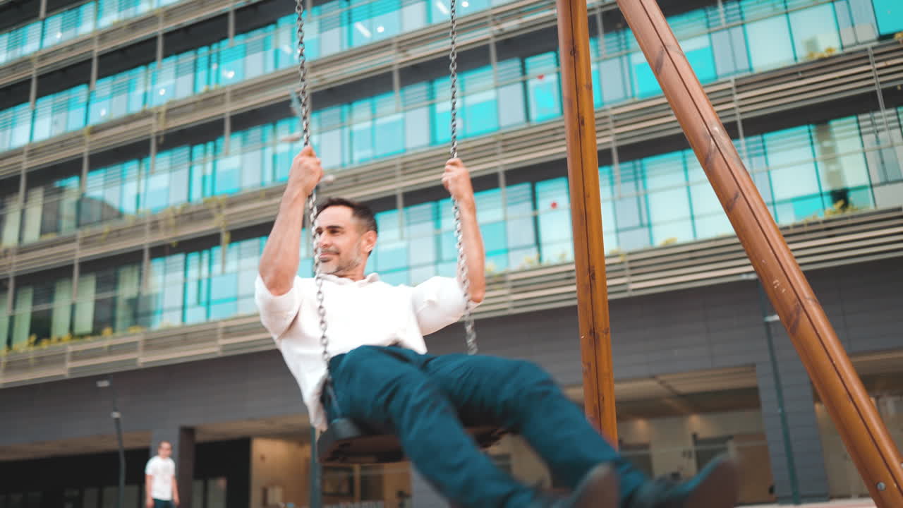 Man swinging on a swing outdoors