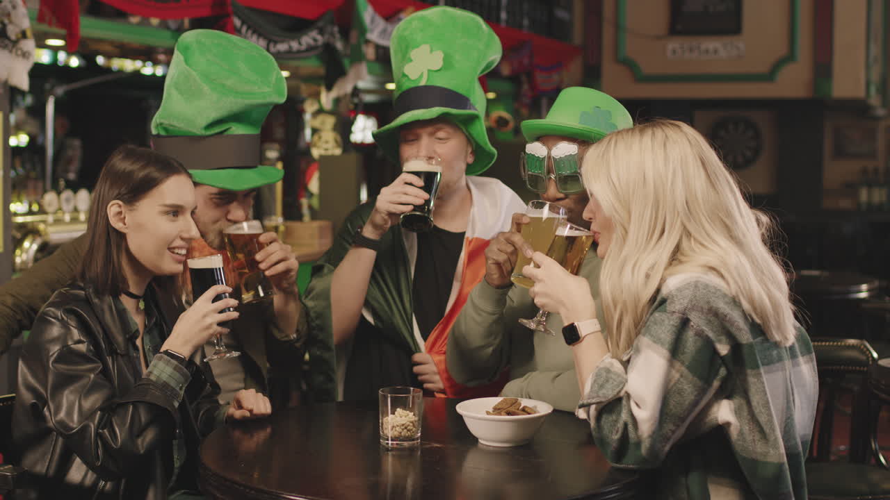 Friends Toasting Beer Glasses On St Patricks Day