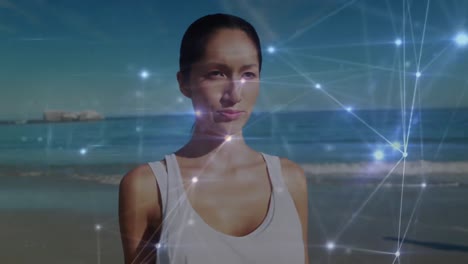 Animation-of-network-of-connections-and-data-processing-over-woman-standing-at-the-beach