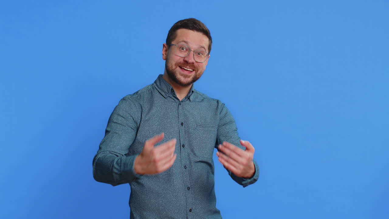 Adult man spread hands and give hug to you pleasant expression love feelings proud satisfied