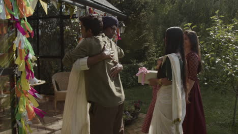 indian family celebration and reunion in a garden