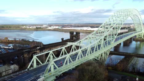 Charity-Santa-dash-fun-run-over-Runcorn-Silver-Jubilee-bridge-Aerial-view-reversing-wide-shot