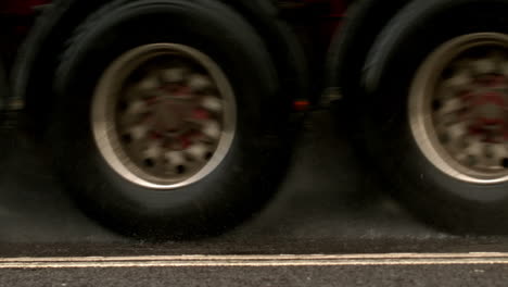 heavy lorry driving over wet road