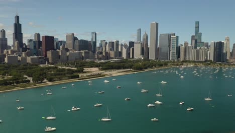 boats in chicago harbor with skyline in background on summer day