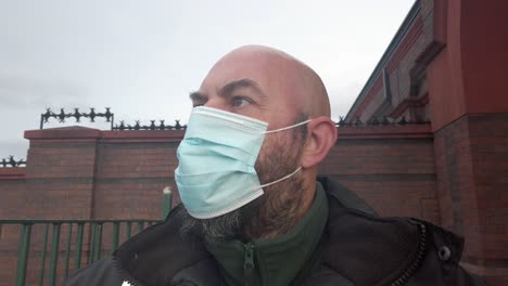 male guard wearing protective corona virus medical ppe mask closeup