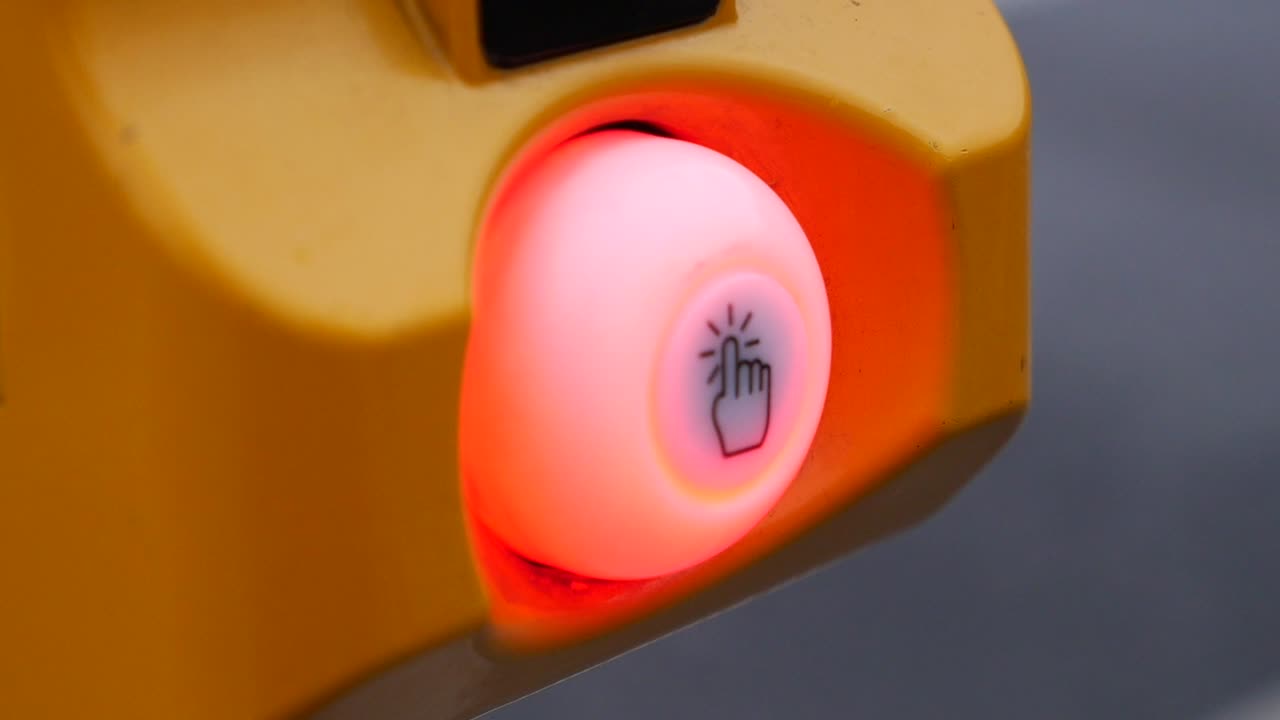 Finger Press on a Yellow Button