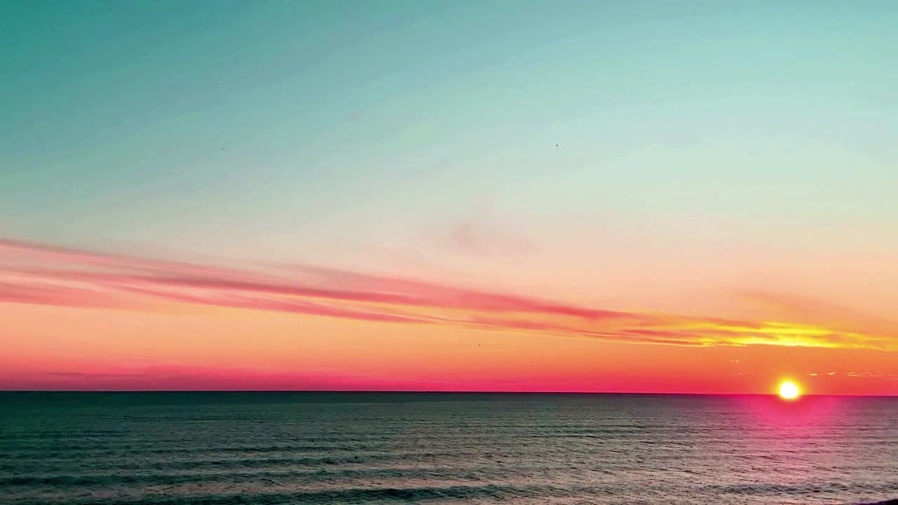 Vibrant ocean sunset with glowing colorful sky