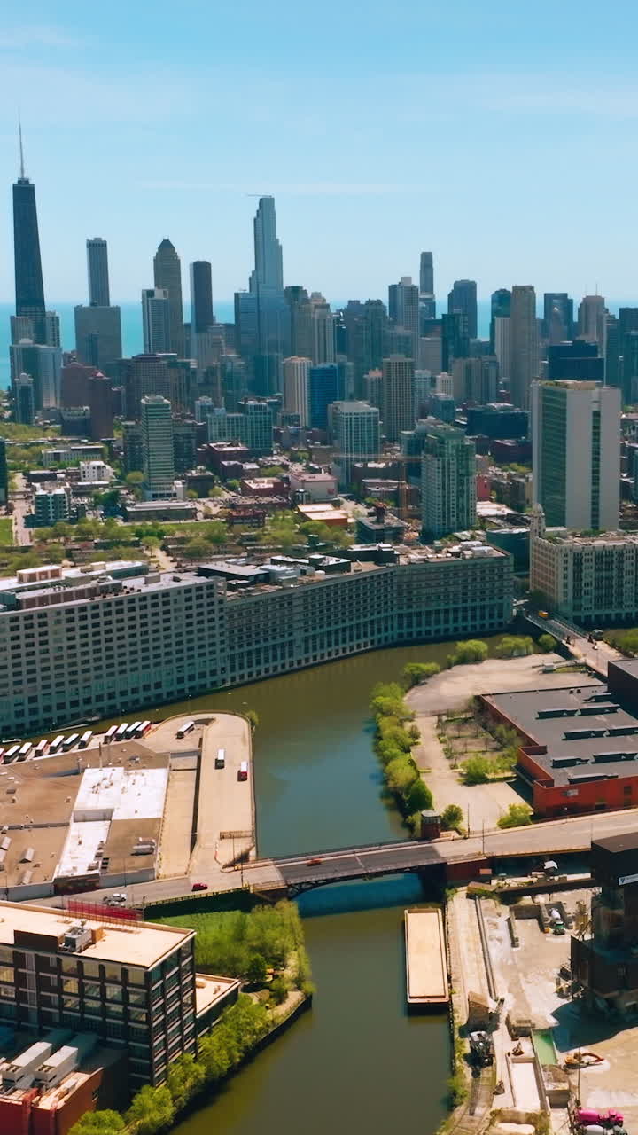 Beautiful scenery of Chicago skyscrapers against Lake Michigan. Usual and plain buildings at the backdrop of modern architecture. Vertical video