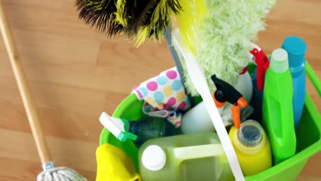 various housekeeping supplies in a bucket