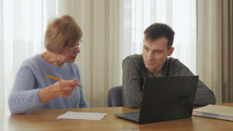 mother tutoring her son online