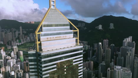 Beautiful-reflections-on-the-top-of-Central-Plaza-skyscraper-and-the-Happy-Valley-racecourse-and-urban-jungle-in-background