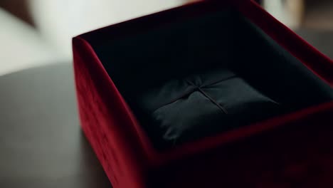 red velvet box with black pillow