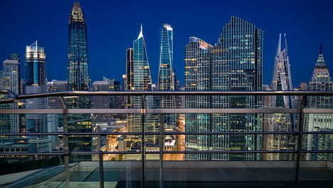 nighttime view of a modern city skyline with illuminated skyscrapers