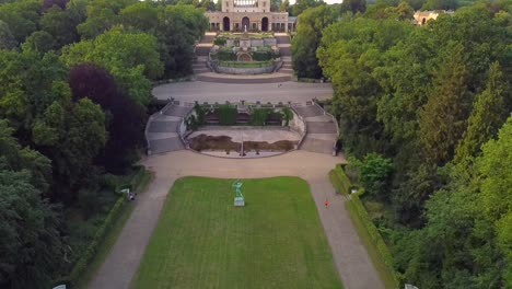 gorgeous aerial drone flight slowly rise up drone shot in a park in summer