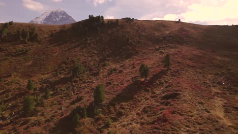 aerial drone footage pushing in and rising up, revealing three mighty peaks eiger, moench and jungfrau in the swiss alps