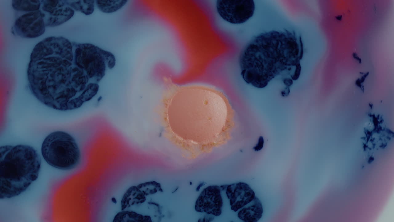 Abstract Fluid Art with Swirls of Pink, Blue, and Red