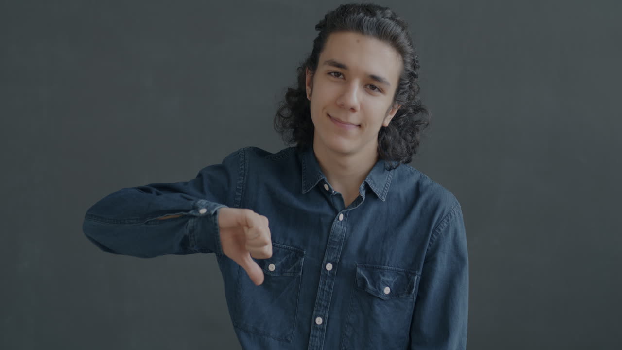 Teenager giving a thumbs down