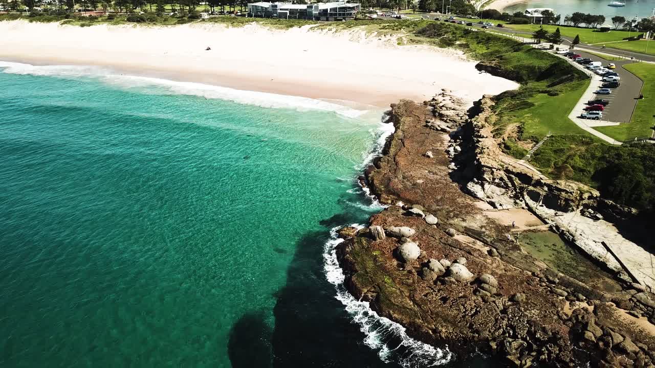 Aerial View of a Stunning Rocky Coastline and Turquoise Ocean