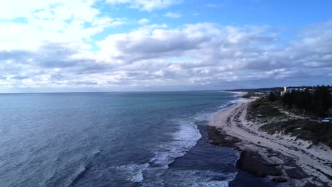 Wide-Aerial-Cottesloe-Beach-pulling-back-descending,-Perth,-Western-Australia