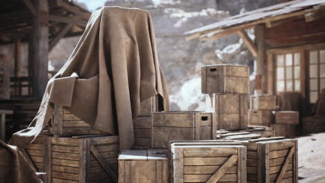 wooden crates covered with fabric in a rustic storage area during daylight