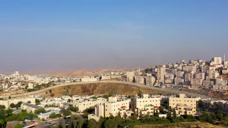 aerial view of a city with a prominent separation barrier