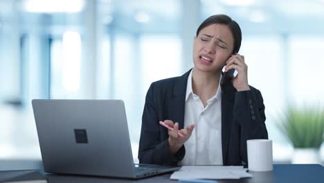 Frustrated-Indian-female-manager-shouting-on-mobile-phone