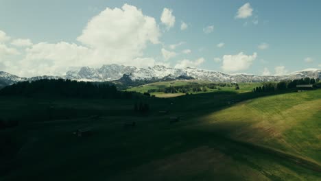 alpine valley landscape with snow-capped mountains