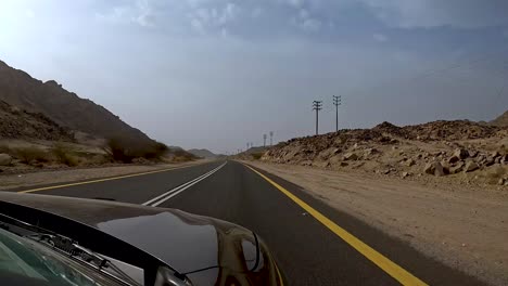 traveling by car on deserted landscape
