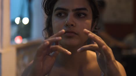 Close-up-of-a-young-Asian-woman-playing-with-her-hands-waiting-for-dinnner-at-the-restaurant