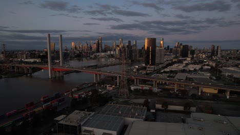 aerial toward melbourne city skyline dusk establishing shot, australia