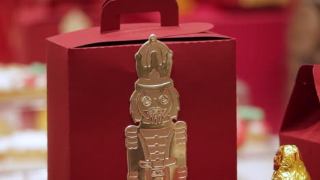 christmas cardboard candy box with engraved golden nutcracker motif