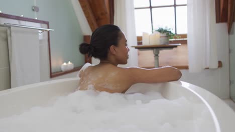 mixed race woman taking a bath