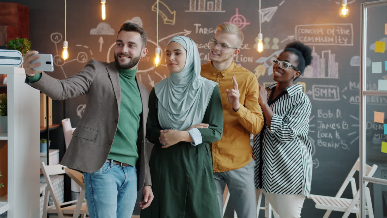 Diverse Team Taking a Selfie in a Modern Office