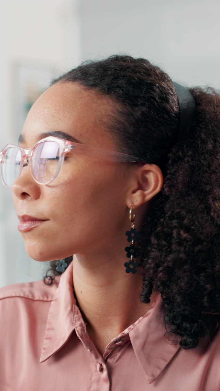 Young Woman with Glasses Smiling and Laughing