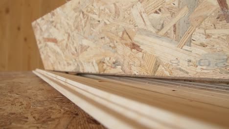 travelling of some osb in detail of a carpentry work in a new building site all made of wood