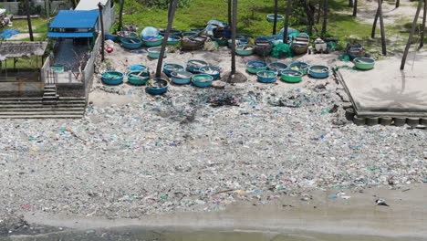 Aerial-drone-shot-of-rubbish-washed-up-on-a-beach-after-a-storm-surge